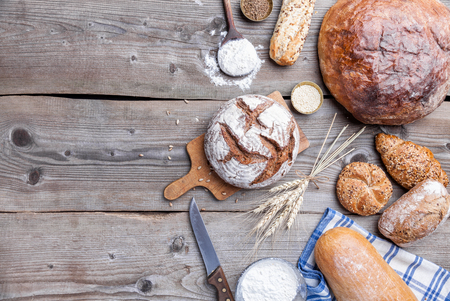 Delicious freshly baked bread on wooden backgroundの写真素材