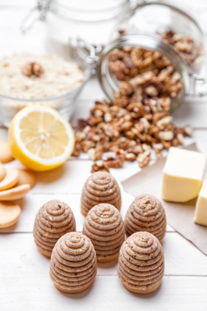 Traditional bee nest cake and ingredients on wooden backgroundの写真素材