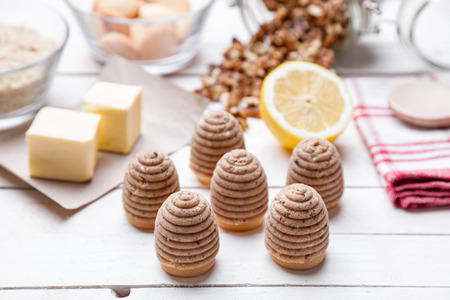 Traditional bee nest cake and ingredients on wooden backgroundの写真素材