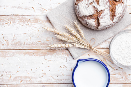 Delicious freshly baked bread on wooden backgroundの写真素材