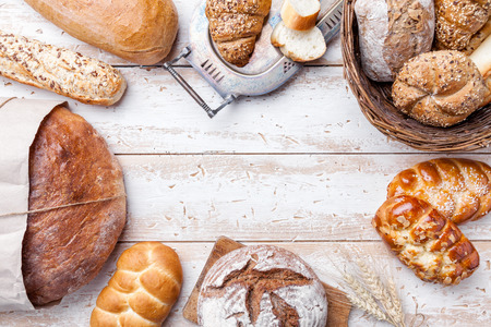 Delicious freshly baked bread on wooden backgroundの写真素材