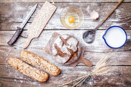Delicious freshly baked bread on wooden backgroundの写真素材