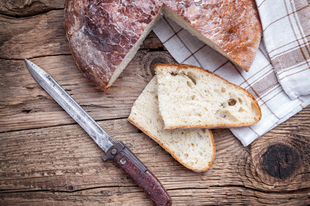 Delicious freshly baked bread on wooden backgroundの写真素材