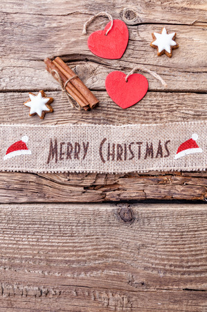 Christmas ribbon on wooden background with copy spaceの写真素材