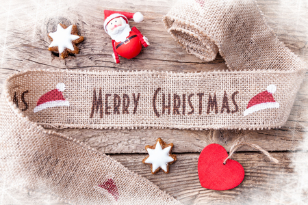 Christmas ribbon on wooden background with copy spaceの写真素材