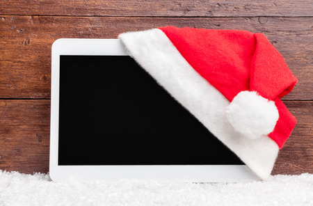 Traditional Christmas decoration and a tablet with copy spaceの写真素材