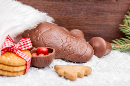 Festive Christmas wooden background with sweets and decorationの写真素材