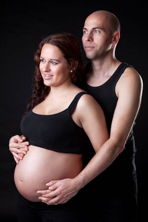 Portrait of young and delighted parents expecting a babyの写真素材