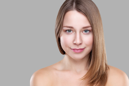 Beautiful young brunette with long straight hairの写真素材