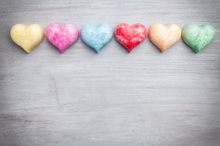 Love concept. Colorful hearts on grey rustic backgroundの写真素材