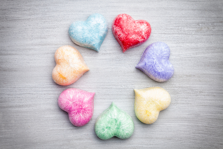 Love concept. Colorful hearts on grey rustic backgroundの写真素材