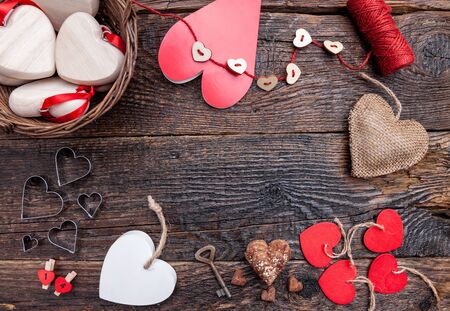 Variety of hearts on an old wooden rustic backgroundの写真素材
