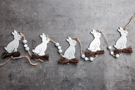Traditional Easter bunnies on a grey rustic backgroundの写真素材
