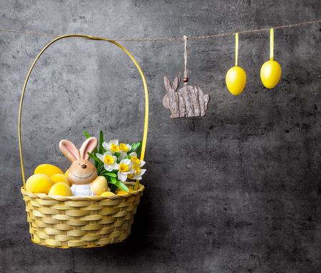 Traditional Easter eggs and bunnies on hanging on rustic backgroundの写真素材
