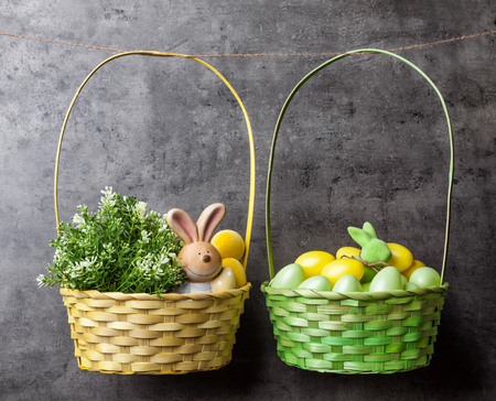 Traditional Easter eggs and bunnies on hanging on rustic backgroundの写真素材