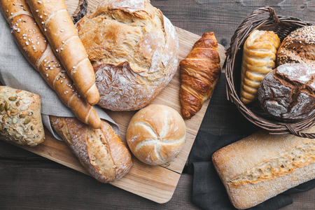 Delicious freshly baked bread on wooden backgroundの写真素材