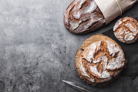 Delicious freshly baked bread on rustic backgroundの写真素材