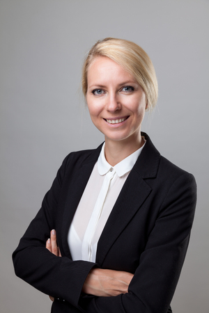 Young and happy business woman in suitの写真素材