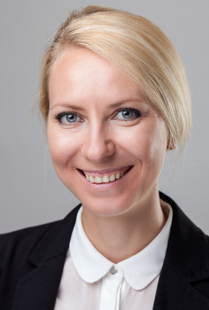 Closeup headshot of young and happy business womanの写真素材