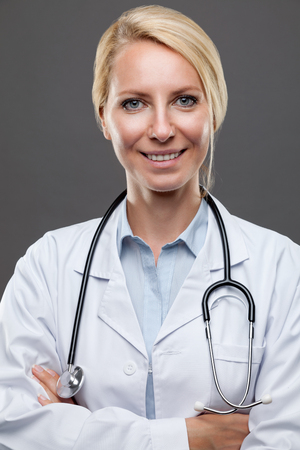 Portrait of a smiling young female doctorの写真素材