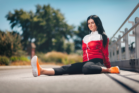 City workout. Beautiful young woman training in an urban settingの写真素材