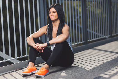City workout. Beautiful young woman with a smartwatch training in an urban settingの写真素材