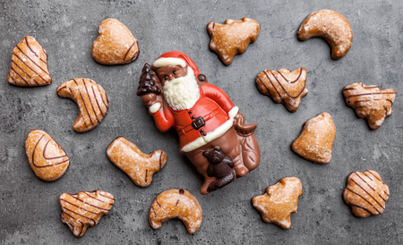 Festive Christmas rustic background with sweets and decorationの写真素材