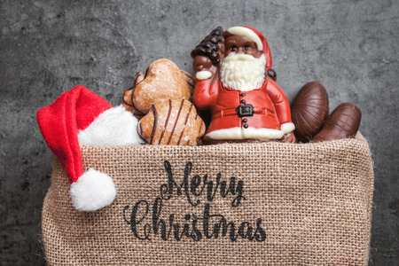 Festive Christmas rustic background with sweets and decorationの写真素材
