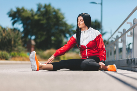 City workout. Beautiful young woman training in an urban settingの写真素材