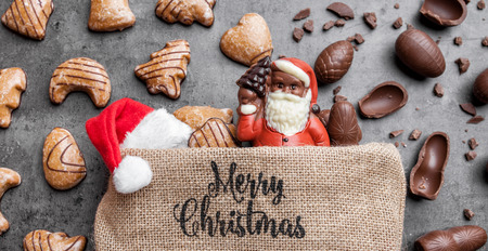 Festive Christmas rustic background with sweets and decorationの写真素材