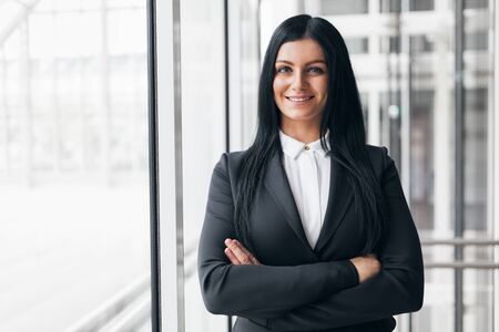 Successful confident young business woman in an office settingの写真素材