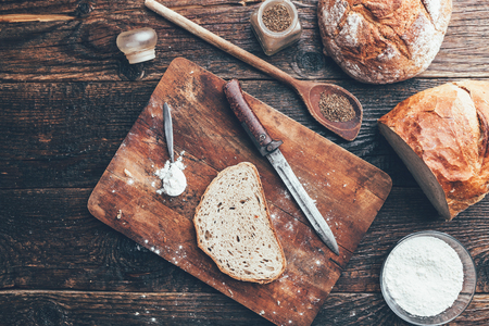Delicious freshly baked bread on wooden backgroundの写真素材