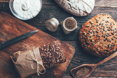 Delicious freshly baked bread on wooden backgroundの写真素材