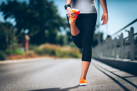 City workout. Beautiful young woman with a smartwatch training in an urban settingの写真素材