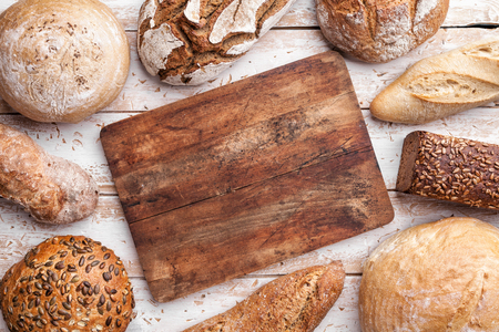 Delicious freshly baked bread on wooden backgroundの写真素材