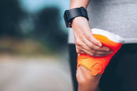 City workout. Beautiful young woman with a smartwatch training in an urban settingの写真素材