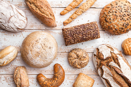 Delicious freshly baked bread on wooden backgroundの写真素材