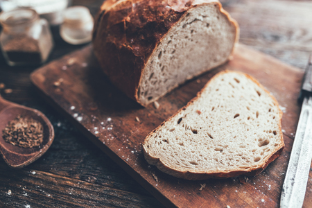 Delicious freshly baked bread on wooden backgroundの写真素材
