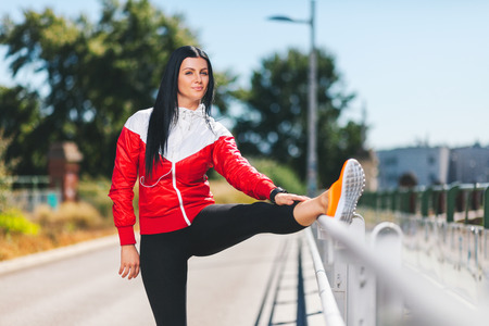 City workout. Beautiful young woman training in an urban settingの写真素材