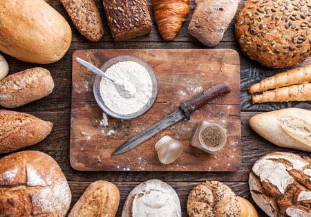 Delicious freshly baked bread on wooden backgroundの写真素材