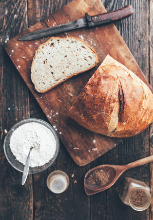 Delicious freshly baked bread on wooden backgroundの写真素材