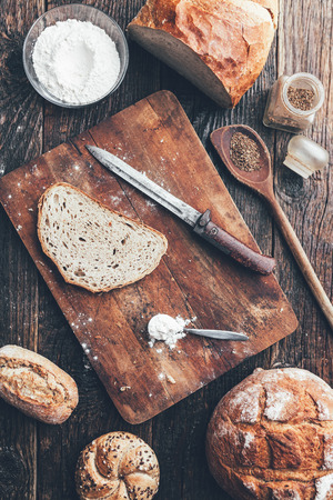 Delicious freshly baked bread on wooden backgroundの写真素材