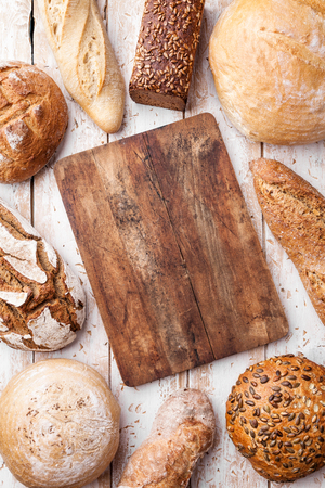Delicious freshly baked bread on wooden backgroundの写真素材