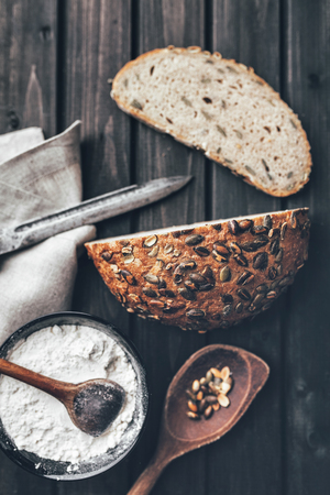 Delicious freshly baked bread on wooden backgroundの写真素材