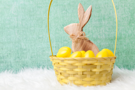Traditional Easter holiday basket with a bunny and eggsの写真素材
