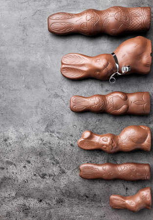 Variety of delicious chocolate Easter bunnies on rustic backgroundの写真素材