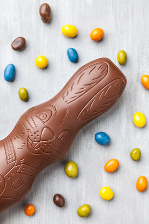 Delicious chocolate Easter bunny and eggs on wooden backgroundの写真素材