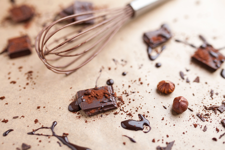 Delicious dark chocolate pieces with cocoa powderの写真素材