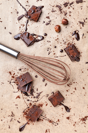 Delicious dark chocolate pieces with cocoa powderの写真素材