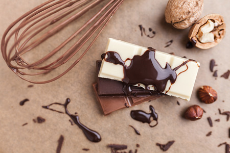 Variety of delicious chocolate bars with melted chocolateの写真素材